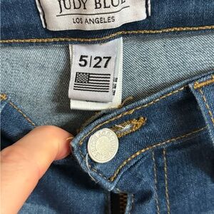 Judy Blue women's blue denim flare jeans with a raw hem edge. NWOT